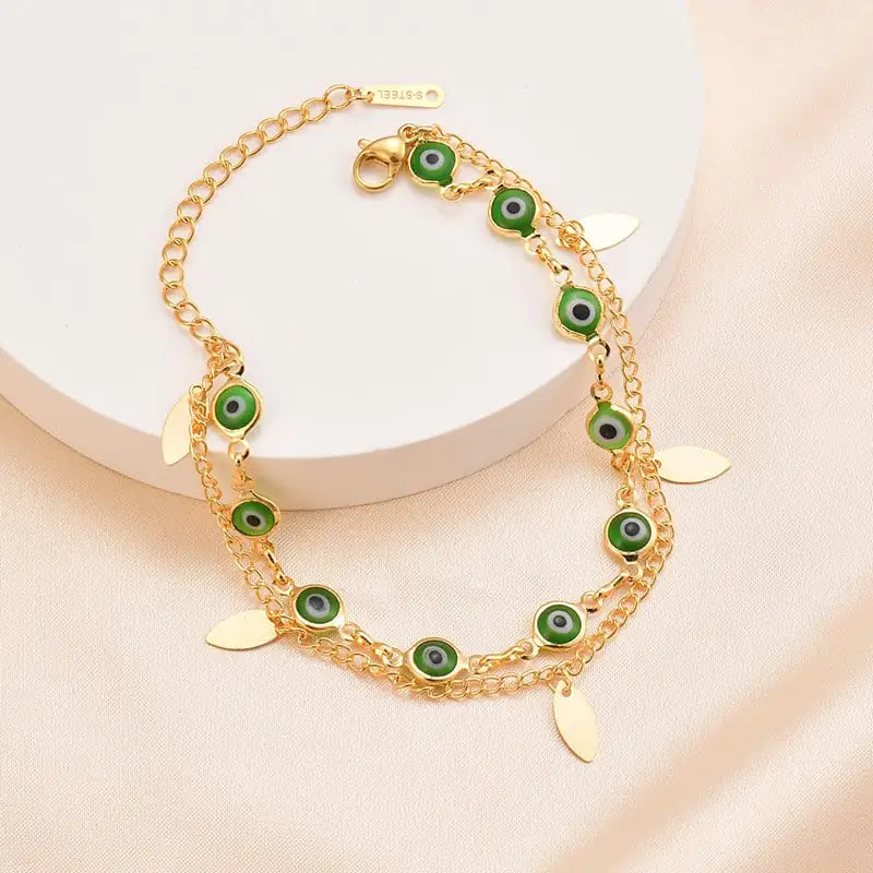 Bransoletka z tytanowej stali pokryta 14-karatowym złotem z podwójnym owalnym motywem