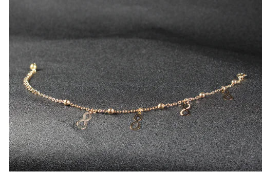 Letnia bransoletka na kostkę z różą, ważką, motylem i muszlami – damska biżuteria z kamieniami