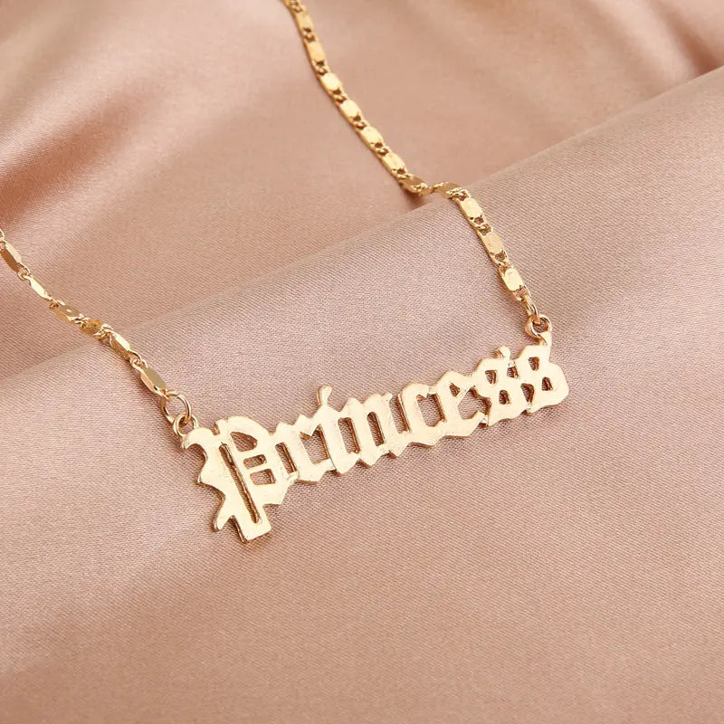 Gold-tone stainless steel necklaces – “Angel” and “Princess”.