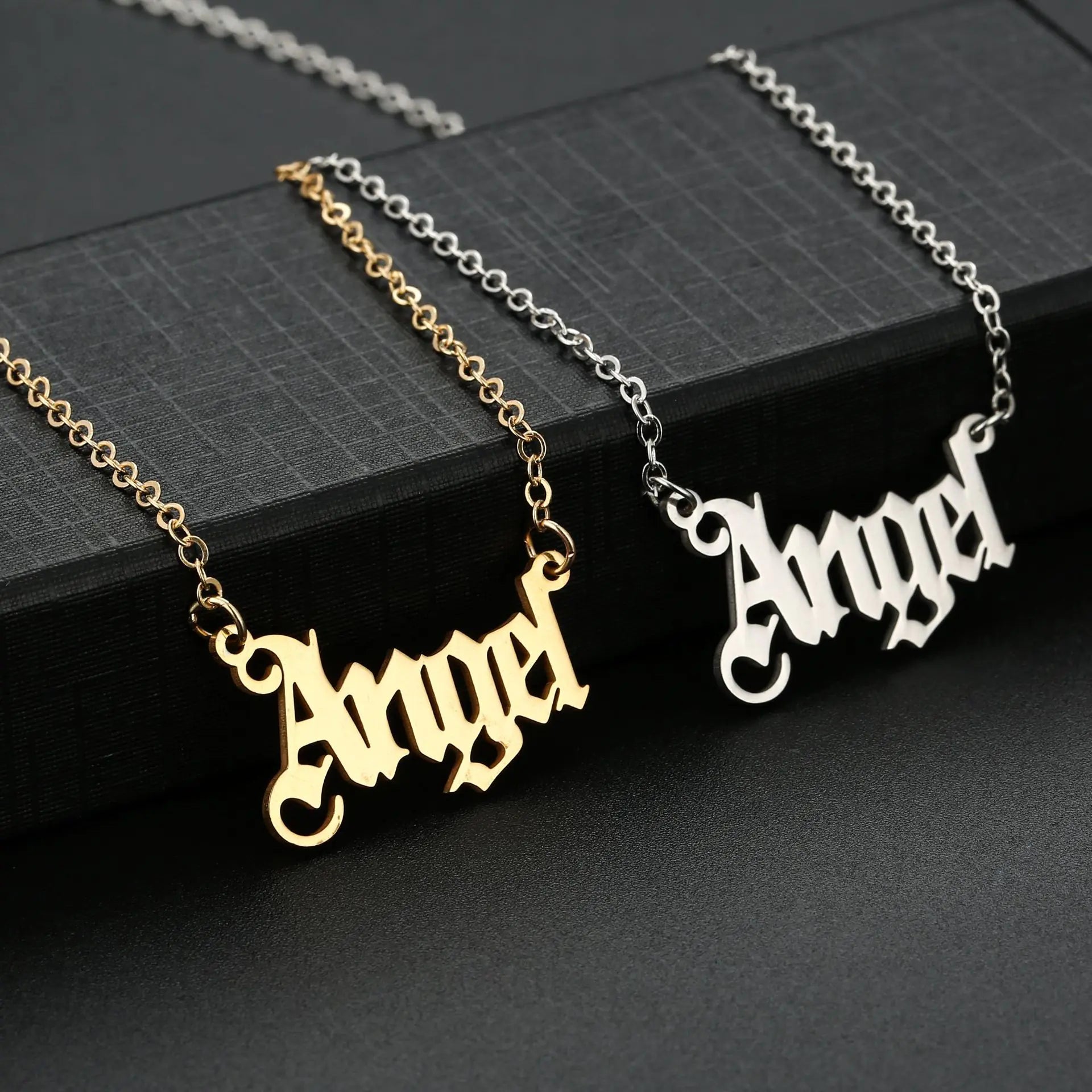Gold-tone stainless steel necklaces – “Angel” and “Princess”.