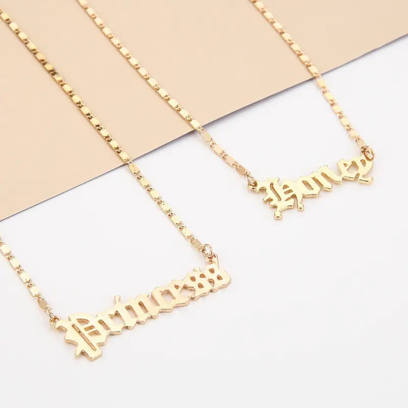 Gold-tone stainless steel necklaces – “Angel” and “Princess”.